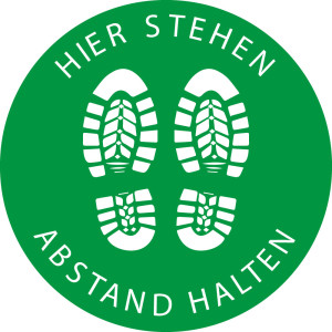 Bodensicherheitszeichen: Hier stehen - Abstand halten, grün-weiß, Bodenmarkierungsfolie selbstklebend, Ø 400 mm, 1 Stück