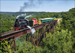 A steam train crosses the 156-foot-tall Bass Point