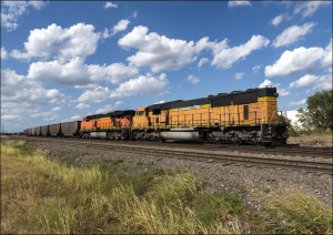 Freight train approaches in an industrial neighborhood of Fort Worth, Texas
