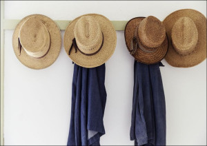 Men’s straw hats, hanging inside the farmhouse at Yoder’s Amish Home., Caro