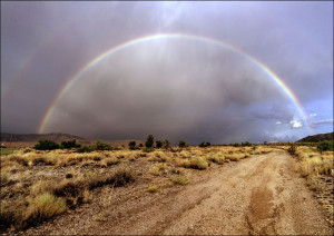 Rainbow across a dirt road near the settlement of Antares in northwestern A