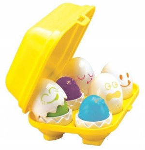 Tomy Piszczące wesołe jajeczka w pojemniku sorter kształtów