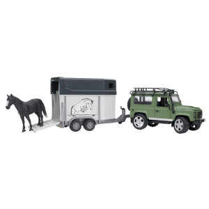Samochód terenowy Land Rover z przyczepką i konikiem