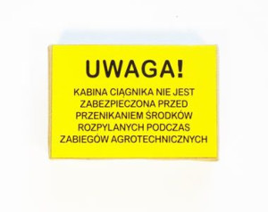 Znak Kabina ciągnika nie jest zabezpieczona