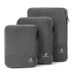 Zestaw trzech szarych kompresyjnych
organizerów na odzież do walizki lub plecaka kostki do pakowania
podróżnego | Packing Cubes