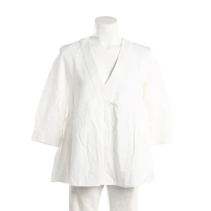 Dior Blusen (beige, Gr. 38) Baumwolle - gebraucht, Tunika mit V-Ausschnitt mit breiter Blende & Peeplum-Schnitt mit leichter Raffung in der Taille