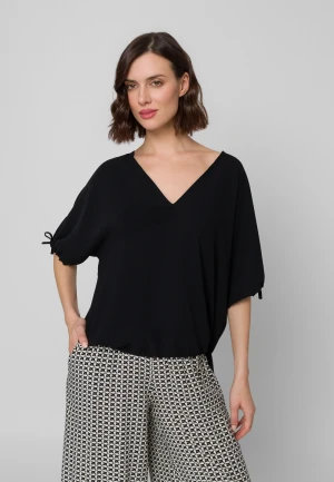 Czarna bluzka oversize ze ściągaczami