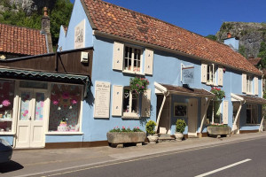 Vegan Afternoon Tea With A Glass Of Fizz With Delicious Vegan Sandwiches, Cakes, Scones And Jam