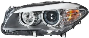 1EL 010 131-011 HELLA Reflektor lampa lewa z silniczkiem do regulacji