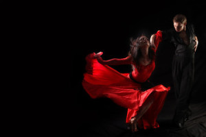 Fototapeta Tango dancer in action against black background