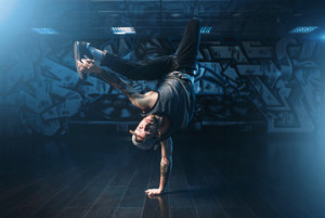 Fototapeta Breakdance Breakdance action, dancer posing in dance studio