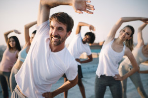 Fototapeta Sport Fitness, sport, friendship and healthy lifestyle concept . Group of happy people exercising
