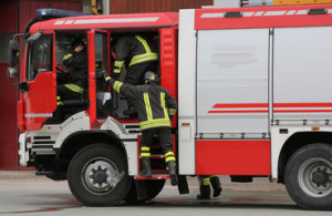 Fototapeta Straż firefighters and the fire engine