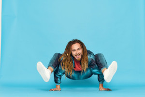 Fototapeta Breakdance young man sitting on the floor