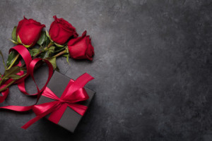 Fototapeta Róże Valentines day card with gift box and rose flowers