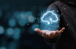 Fototapeta Informatyka Businessman holding virtual cloud computing to transfer data information and upload download application. Technology