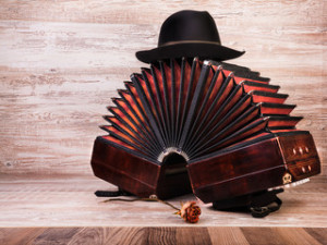 Fototapeta Tango Bandoneon, tango instrument, and a hut