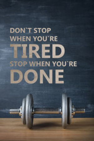 Fototapeta Motywacja metal barbell on dark gray background and motivation text