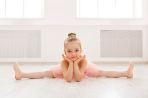 Fototapeta Balet Portrait of little ballerina on floor, copy space