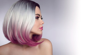 Fototapeta Fryzjerstwo Ombre bob short hairstyle. Beautiful hair coloring woman. Trendy haircuts. Blond model with short shiny hairstyle. Concept