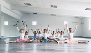 Fototapeta Balet Choreographed dance by a group of beautiful young ballerinas practicing during class at a classical ballet school.
