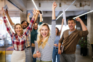 Fototapeta Ludzie Happy business people celebrating success at company