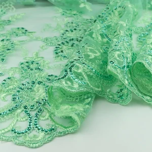 Koronka materiał w kwiaty kolor seledynowy, cekiny TextileClub 