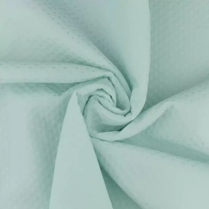 Tkanina żakard wzór geometryczny kolor pastelowa pistacja TextileClub 