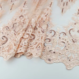 Koronka materiał w kwiaty kolor brzoskwiniowy TextileClub 