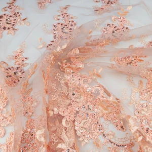 Koronka materiał w kwiaty kolor brzoskwiniowy