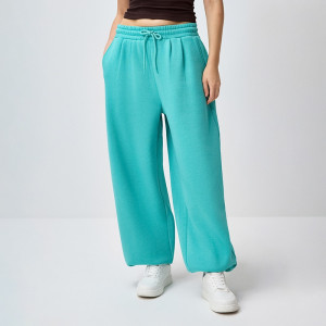 Turkusowe spodnie dresowe basic o kroju jogger - House - turkusowy - 385KS-66X