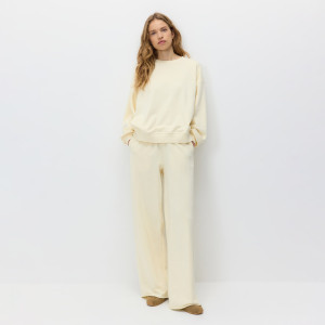 Spodnie dresowe z szerokimi nogawkami - L - kremowy - damska - Reserved - 002HT-02X
