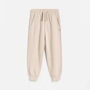 Bawełniane spodnie jogger - 152 (11 lat) - beżowy - chłopcy - Reserved - 717JU-08X