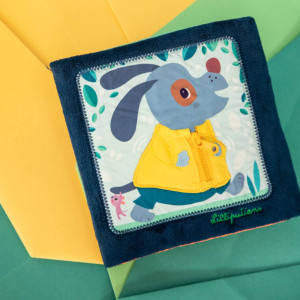 Lilliputiens Książeczka edukacyjna "Uczę się sam ubierać" Piesek Jules 18 m+- sklep z zabawkami online